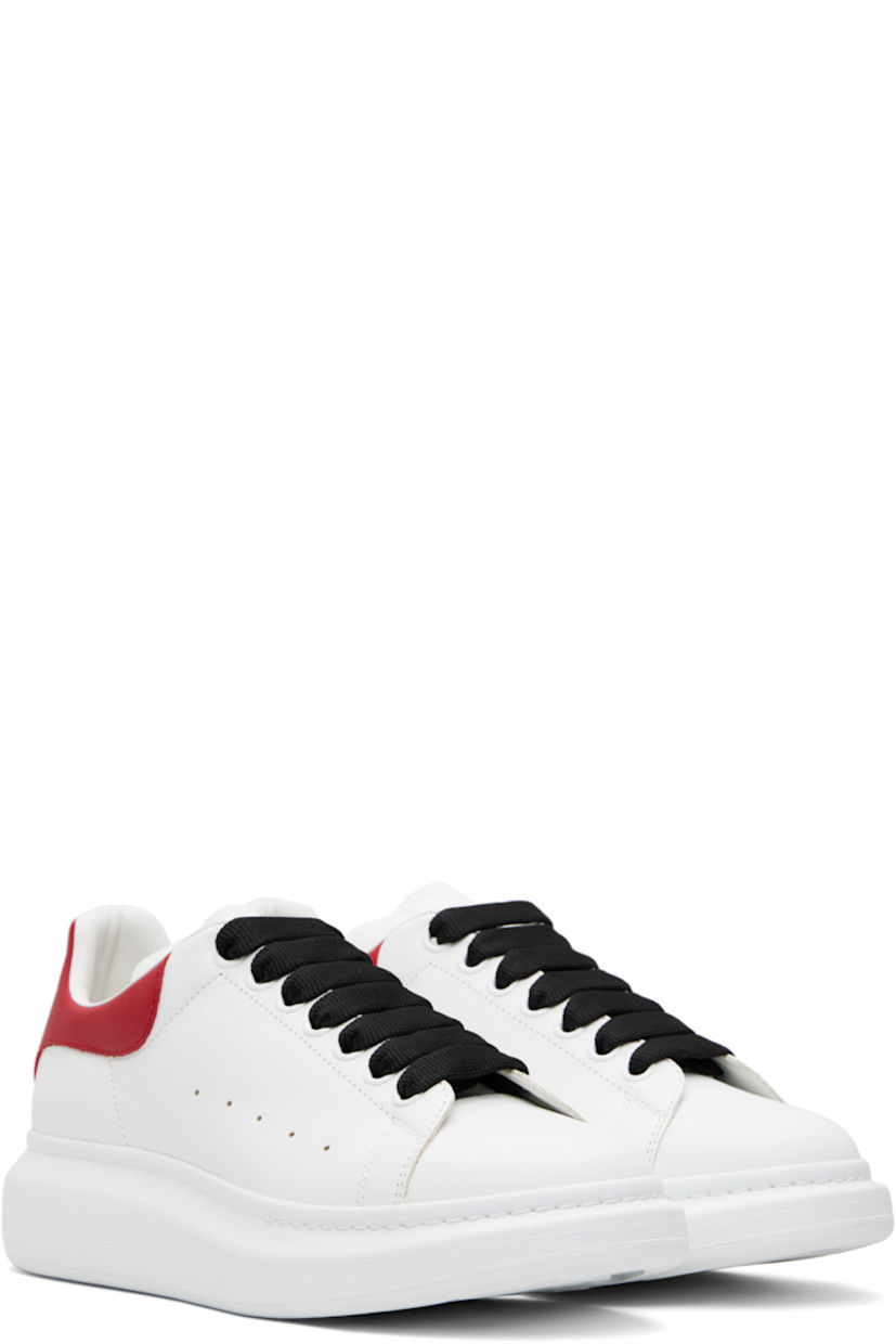 Low-top buffed calfskin sneakers.

· Lace-up closure
· Logo printed at tongue
· Padded tongue and collar
· Perforations at sides
· Logo printed at polished calfskin heel tab
· Treaded rubber sole
· Includes additional laces

Supplier color: Off white/Red