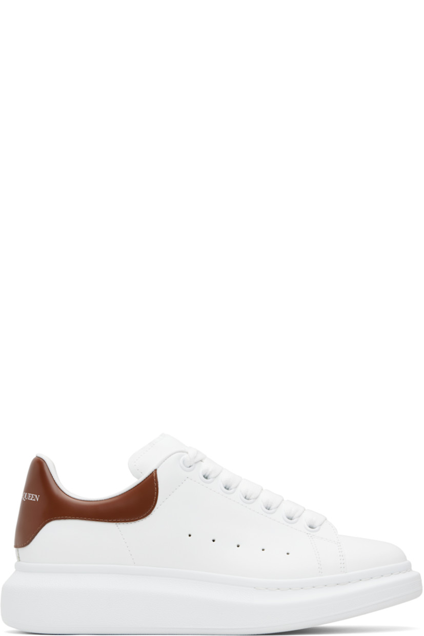 Low-top buffed calfskin sneakers.

· Lace-up closure
· Logo printed at tongue
· Padded tongue and collar
· Perforations at sides
· Logo printed at polished calfskin heel tab
· Treaded rubber sole
· Includes additional laces

Supplier color: White/Sandal brown