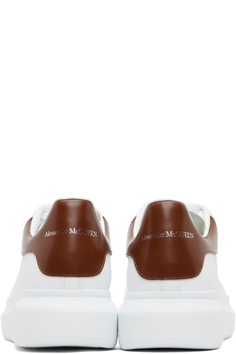 Low-top buffed calfskin sneakers.

· Lace-up closure
· Logo printed at tongue
· Padded tongue and collar
· Perforations at sides
· Logo printed at polished calfskin heel tab
· Treaded rubber sole
· Includes additional laces

Supplier color: White/Sandal brown