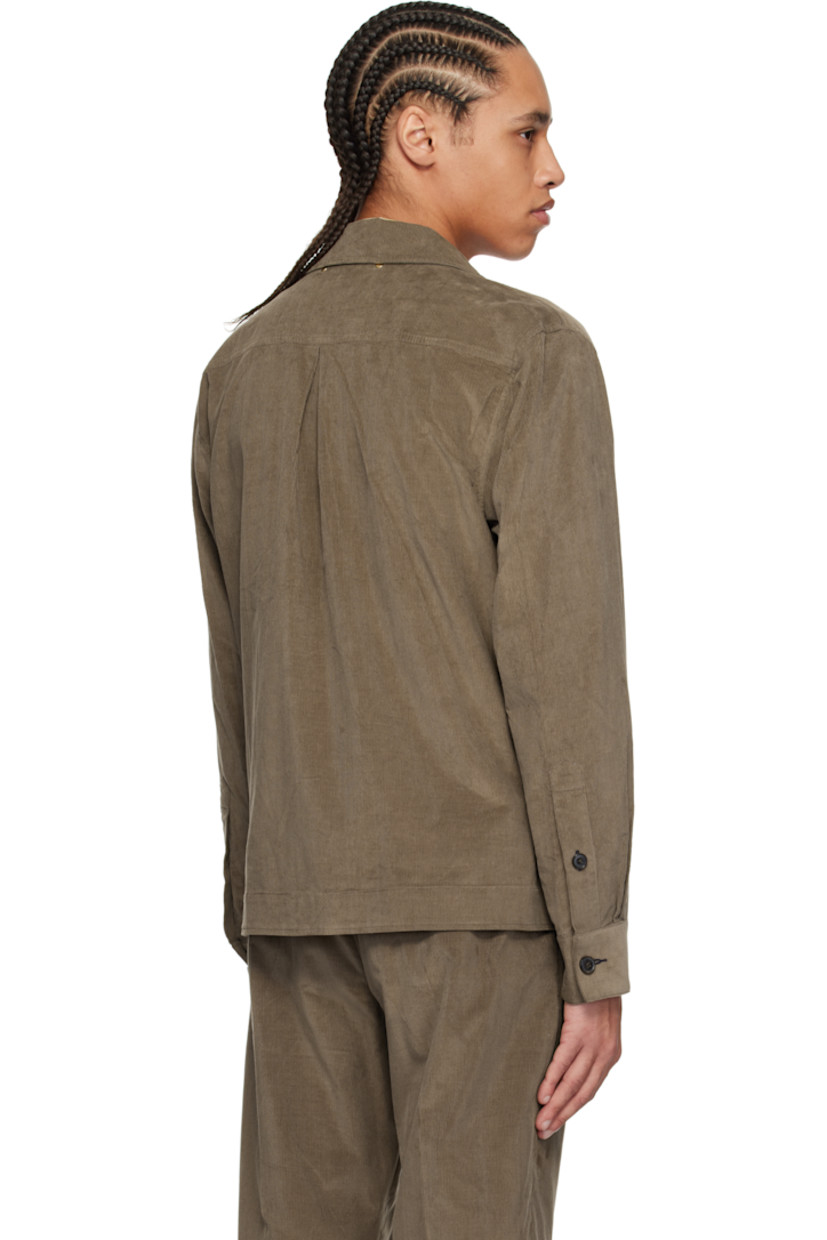 Cotton corduroy jacket. 

· Spread collar
· Two-way zip closure
· Pleats at buttoned barrel cuffs
· Rivets at back collar
· Inverted box pleat at back yoke

Supplier color: Brown