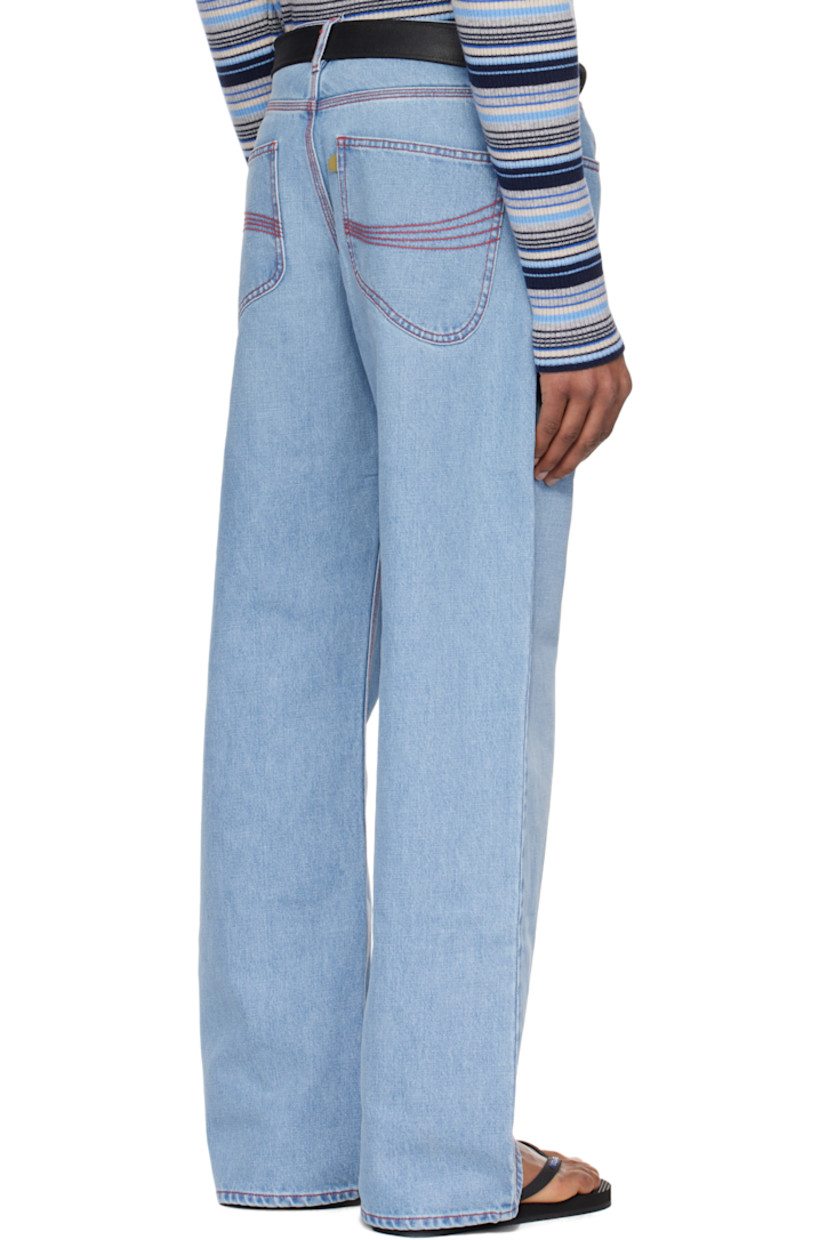 Straight-leg non-stretch denim jeans. Fading throughout.

· Belt loops
· Five-pocket styling
· Zip fly
· Logo flag at back pocket
· Logo-engraved antiqued silver-tone hardware
· Contrast stitching in red

Supplier color: Blue