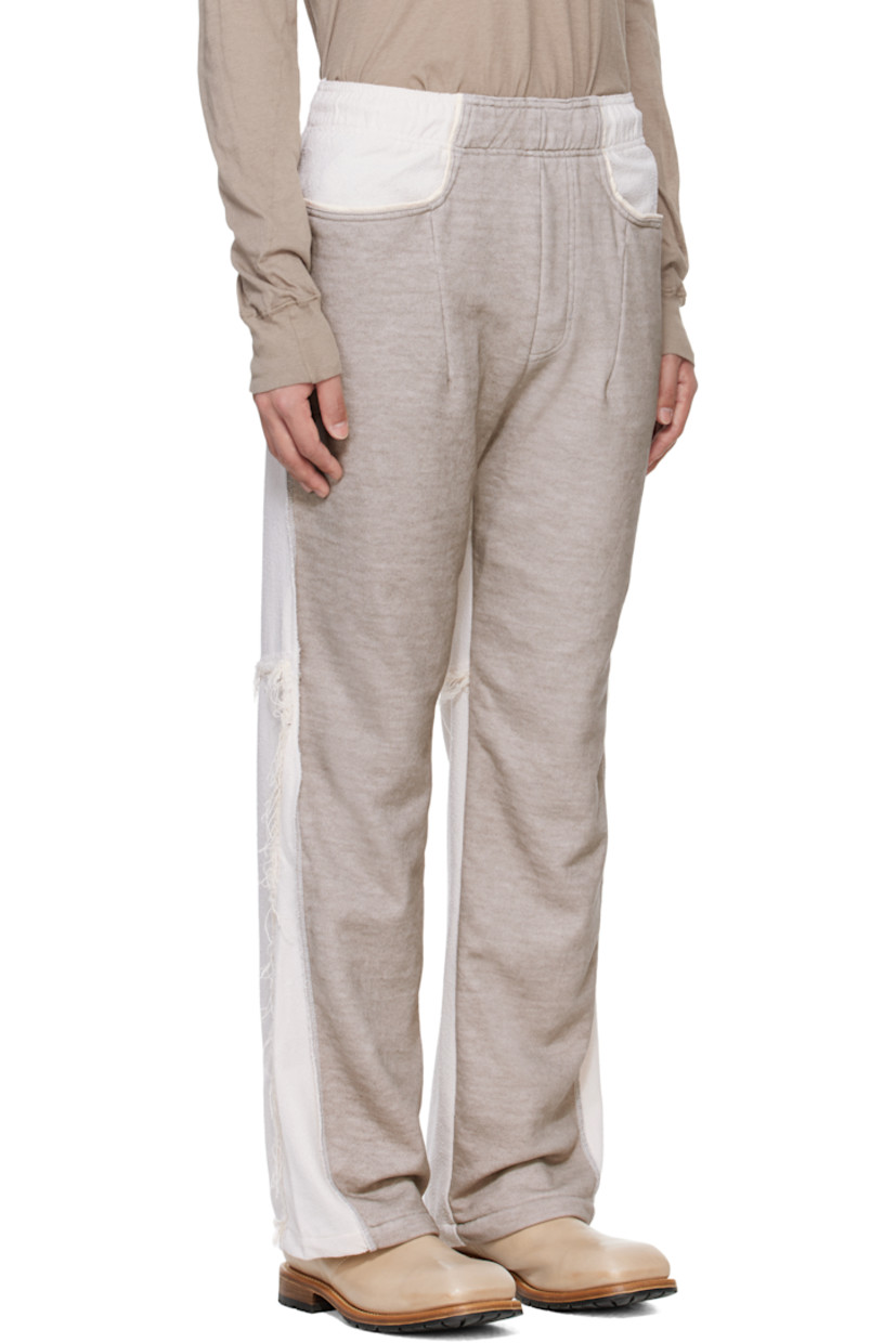 French terry trousers. Plain-woven tencel-blend trim throughout.

· Paneled construction 
· Concealed drawstring at elasticized waistband
· Three-pocket styling
· Mock fly
· Darts at front 
· Overlock stitching at pinched outseams 
· Frayed edges at back 

Supplier color: Gray