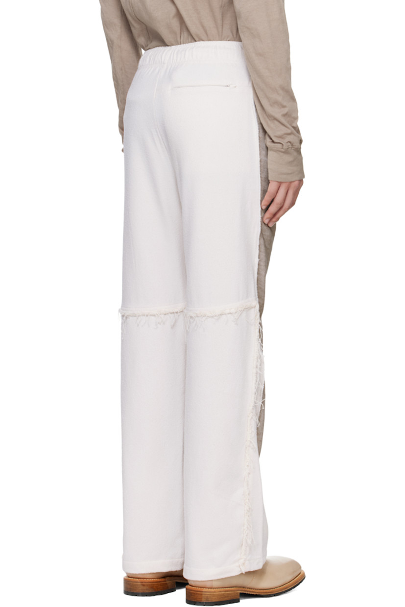 French terry trousers. Plain-woven tencel-blend trim throughout.

· Paneled construction 
· Concealed drawstring at elasticized waistband
· Three-pocket styling
· Mock fly
· Darts at front 
· Overlock stitching at pinched outseams 
· Frayed edges at back 

Supplier color: Gray