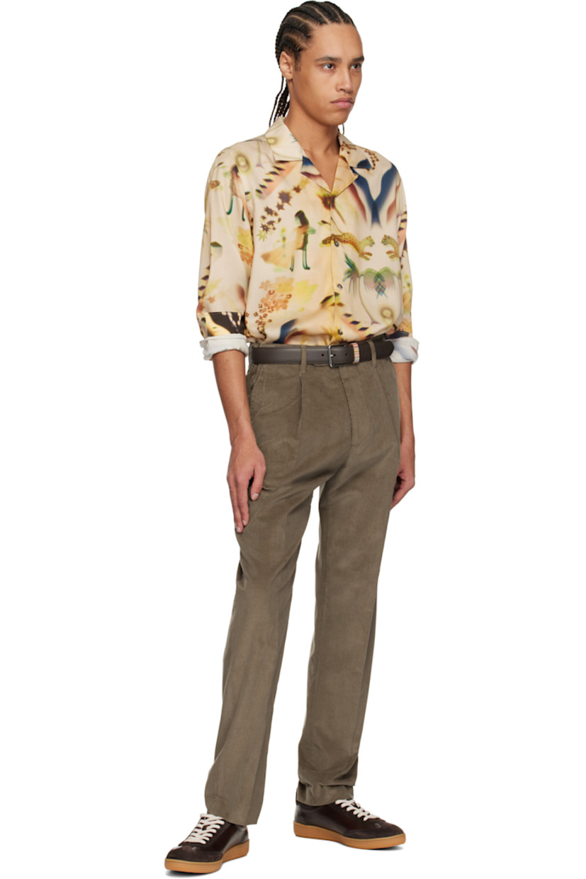 Lyocell twill shirt. Graphic pattern printed throughout.

· Button fastening at open spread collar 
· Button closure
· Shirttail hem 
· Pleats at buttoned barrel cuffs
· Inverted box pleat at back yoke 

Supplier color: Beige