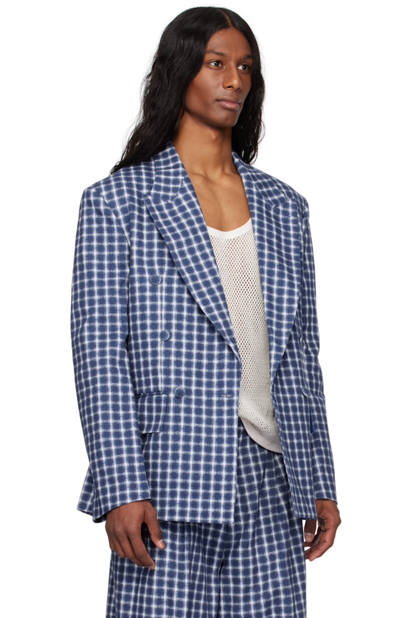 Cotton canvas blazer. Jacquard check pattern throughout.

· Peaked lapel
· Double-breasted button closure
· Welt pocket at chest
· Flap pockets
· Padded shoulders
· Twin vents at back hem
· Welt pockets at interior
· Full cotton broadcloth lining

Supplier color: Navy