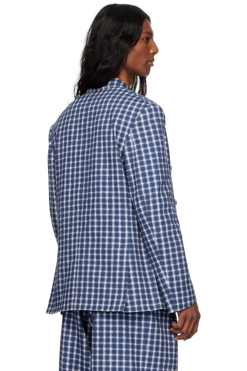 Cotton canvas blazer. Jacquard check pattern throughout.

· Peaked lapel
· Double-breasted button closure
· Welt pocket at chest
· Flap pockets
· Padded shoulders
· Twin vents at back hem
· Welt pockets at interior
· Full cotton broadcloth lining

Supplier color: Navy