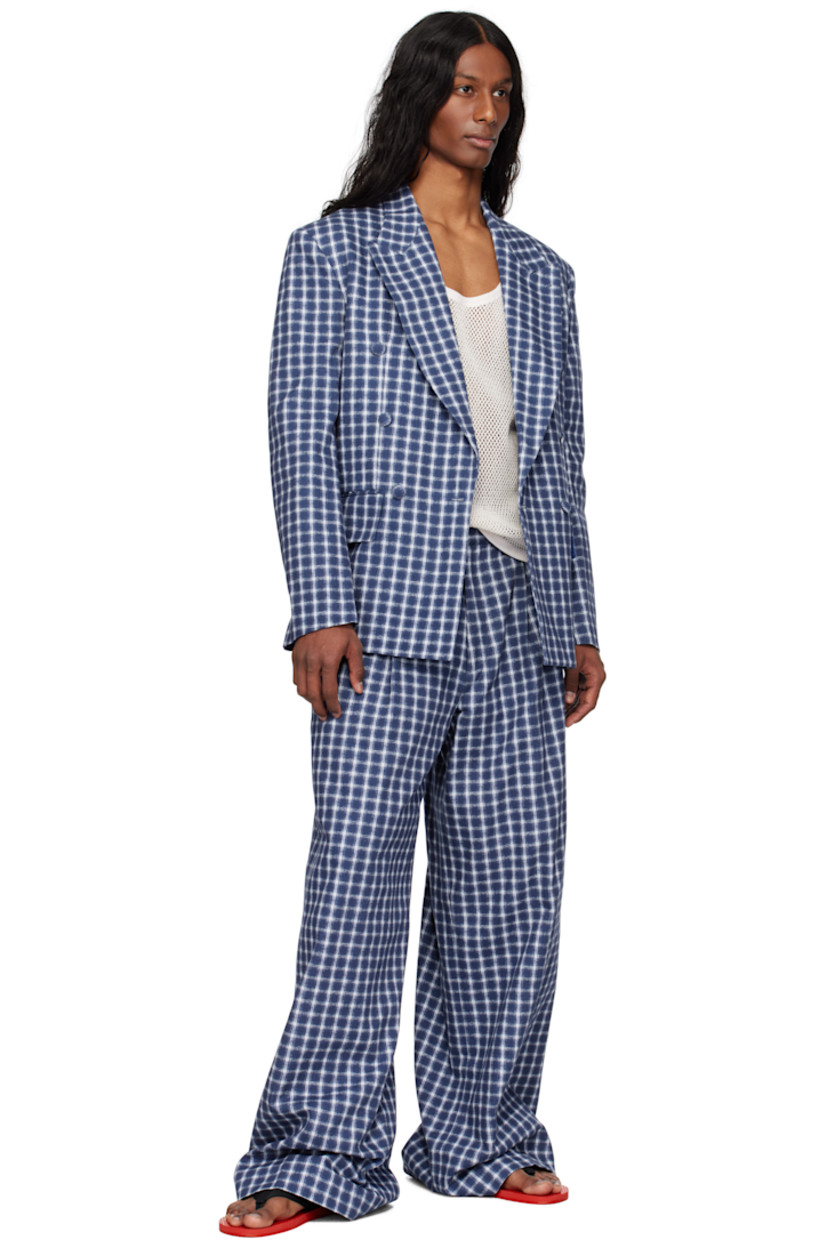 Cotton canvas blazer. Jacquard check pattern throughout.

· Peaked lapel
· Double-breasted button closure
· Welt pocket at chest
· Flap pockets
· Padded shoulders
· Twin vents at back hem
· Welt pockets at interior
· Full cotton broadcloth lining

Supplier color: Navy