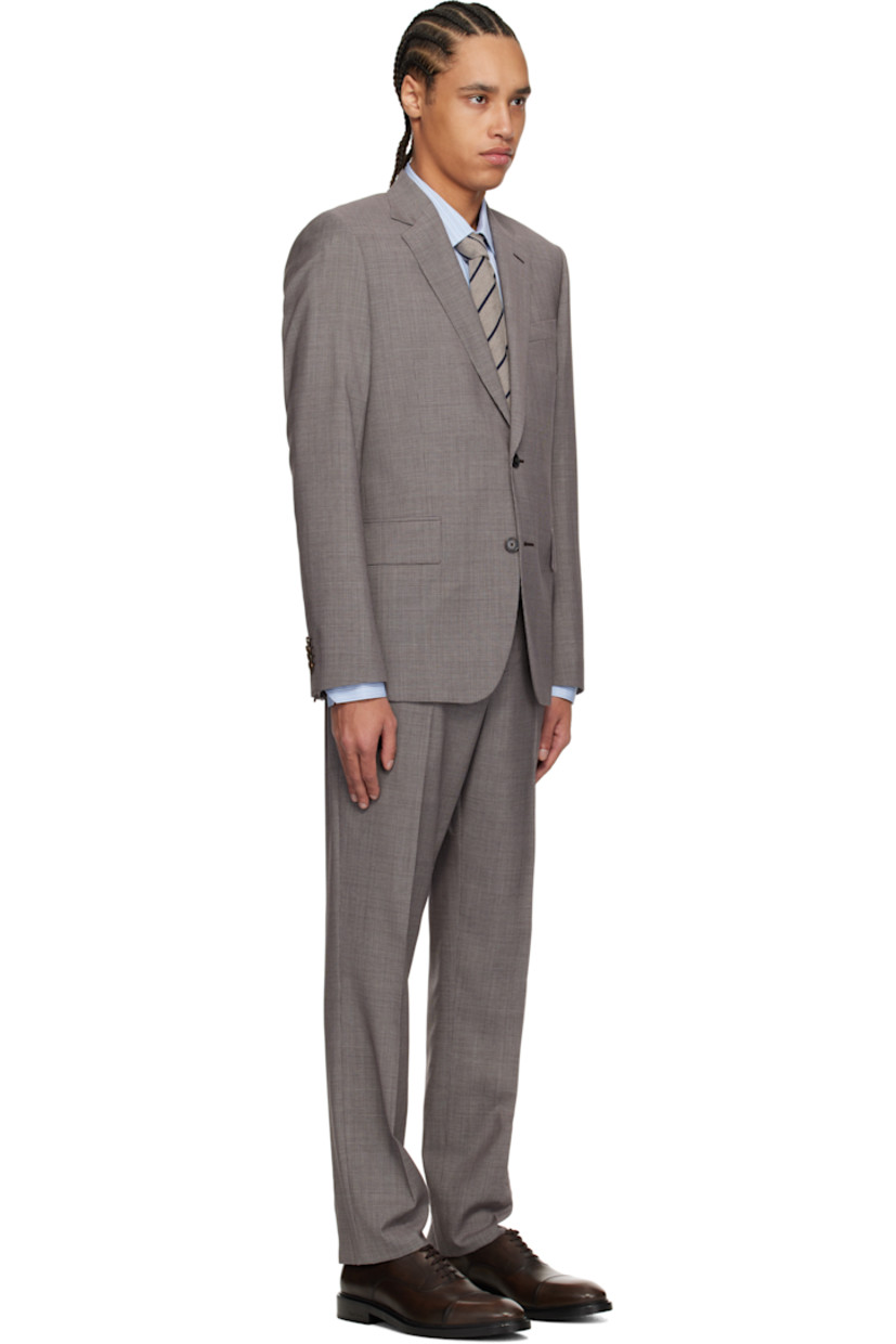 Wool tweed blazer. Houndstooth pattern throughout. 

· Notched lapel
· Button closure
· Welt pocket 
· Flap pockets
· Vented side seams
· Padded shoulders
· Four-button surgeon's cuffs
· Welt pockets at interior
· Full viscose satin lining

Wool tweed trousers. Houndstooth pattern throughout.

· Belt loops
· Four-pocket styling
· Zip fly
· Creased legs
· Partial satin lining

Supplier color: Grey