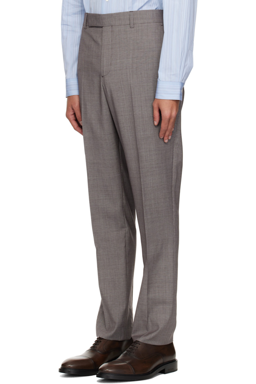 Wool tweed blazer. Houndstooth pattern throughout. 

· Notched lapel
· Button closure
· Welt pocket 
· Flap pockets
· Vented side seams
· Padded shoulders
· Four-button surgeon's cuffs
· Welt pockets at interior
· Full viscose satin lining

Wool tweed trousers. Houndstooth pattern throughout.

· Belt loops
· Four-pocket styling
· Zip fly
· Creased legs
· Partial satin lining

Supplier color: Grey