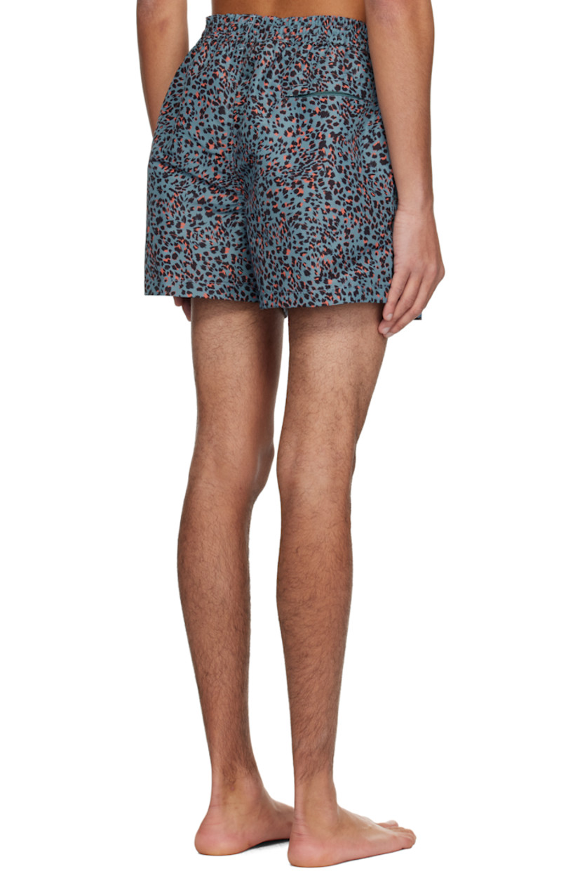 Recycled polyester taffeta swim shorts. Leopard pattern printed throughout.

· Drawstring and logo flag at elasticized waistband
· Three-pocket styling
· Vented outseams
· Locker loop at back waistband
· Briefs-style mesh lining

Supplier color: Blue