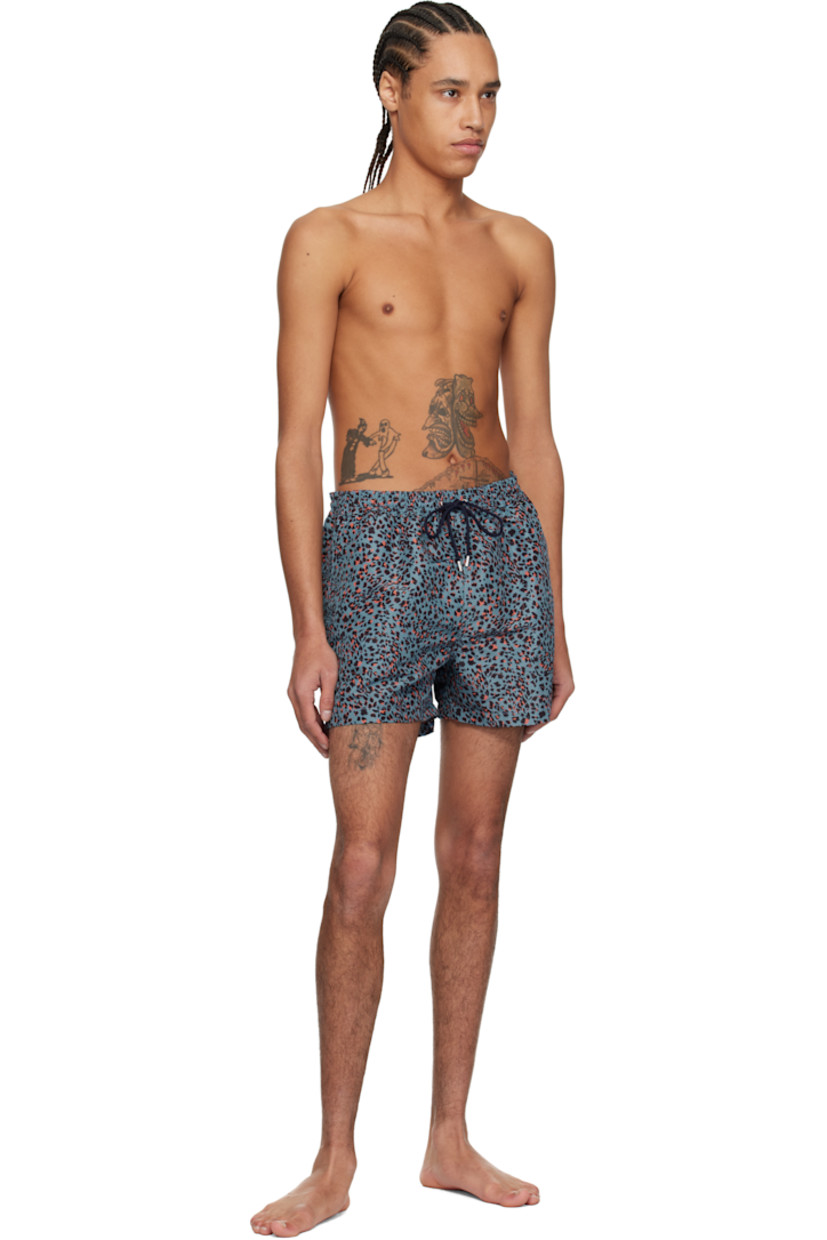 Recycled polyester taffeta swim shorts. Leopard pattern printed throughout.

· Drawstring and logo flag at elasticized waistband
· Three-pocket styling
· Vented outseams
· Locker loop at back waistband
· Briefs-style mesh lining

Supplier color: Blue