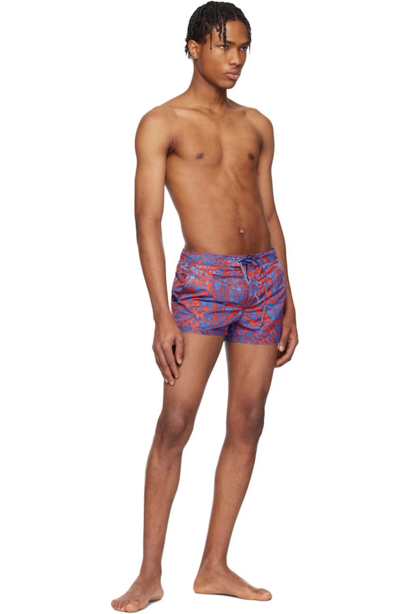 Polyester taffeta swim shorts. Floral pattern printed throughout.

· Logo-woven drawstring at waistband
· Three-pocket styling
· Velcro fly
· Logo patch and grommet at back pocket
· Partial mesh lining
· Logo-engraved silver-tone hardware

Supplier color: Floral print