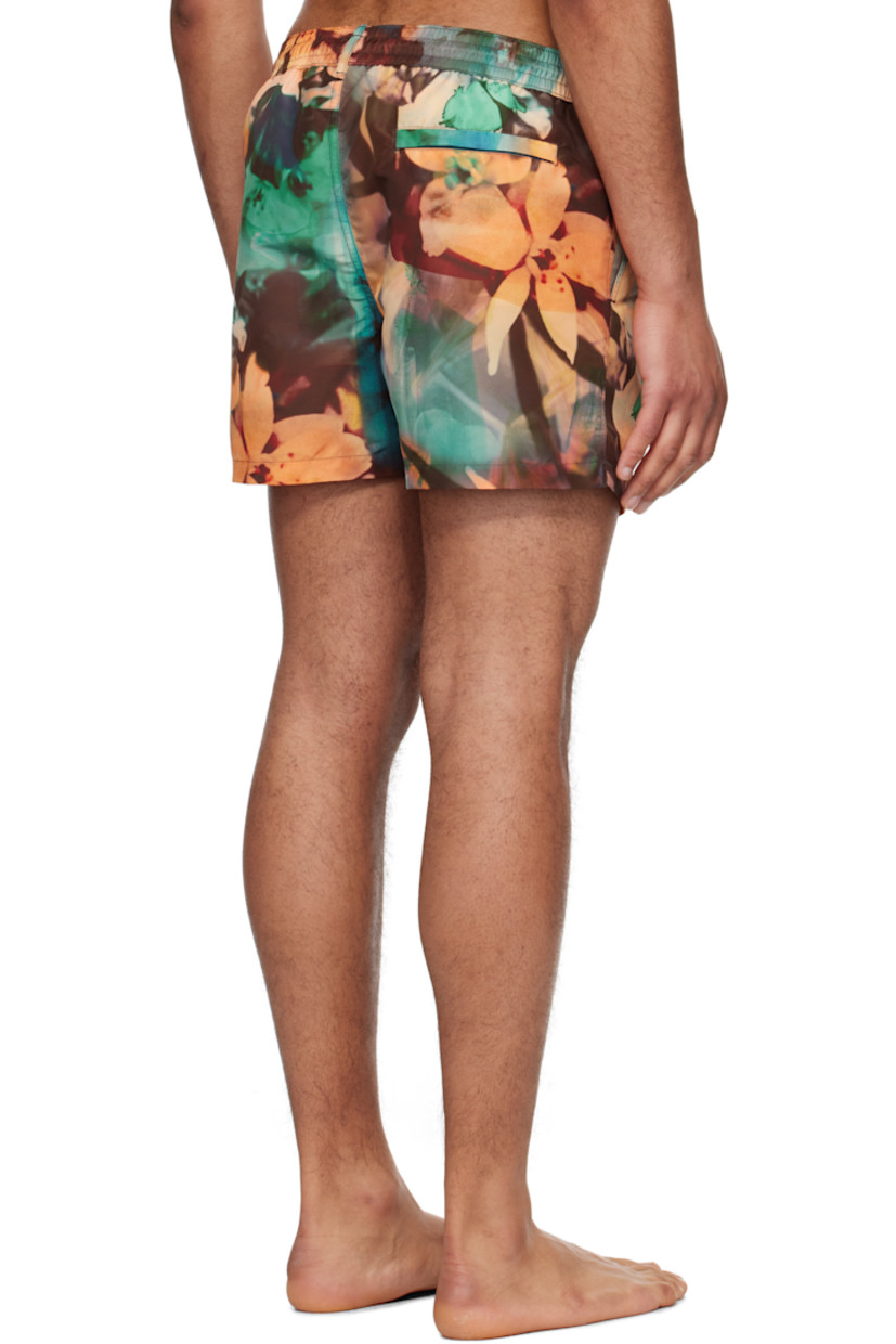 Recycled polyester taffeta swim shorts. Graphic pattern printed throughout.

· Drawstring and logo flag at elasticized waistband
· Three-pocket styling
· Vented outseams
· Locker loop at back waistband
· Briefs-style mesh lining
· Logo-engraved silver-tone hardware

Supplier color: Painted photograph