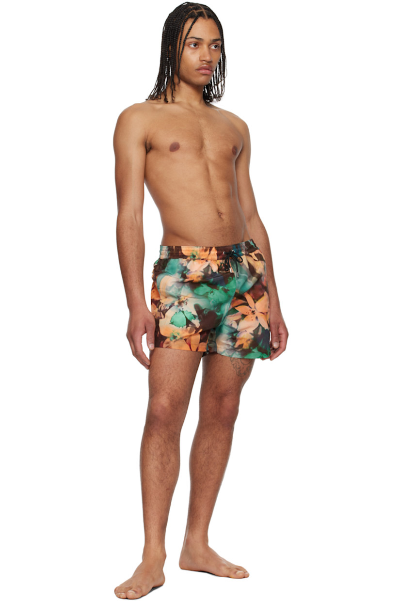 Recycled polyester taffeta swim shorts. Graphic pattern printed throughout.

· Drawstring and logo flag at elasticized waistband
· Three-pocket styling
· Vented outseams
· Locker loop at back waistband
· Briefs-style mesh lining
· Logo-engraved silver-tone hardware

Supplier color: Painted photograph