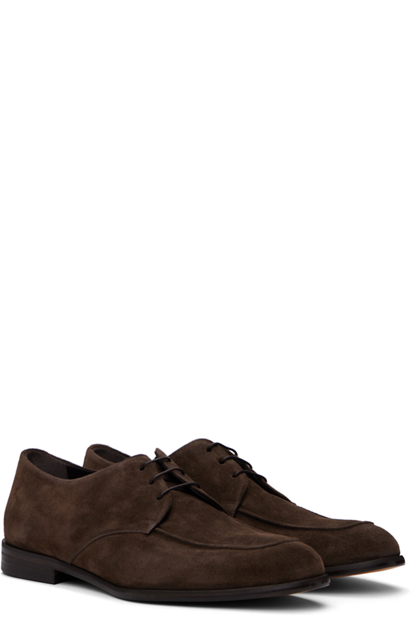 Suede derbys in brown.

· Almond moc toe
· Lace-up closure
· Contrast stitches at heel tab
· Buffed leather and suede lining
· Stacked leather block heel
· Polished leather sole

Supplier color: Dark brown