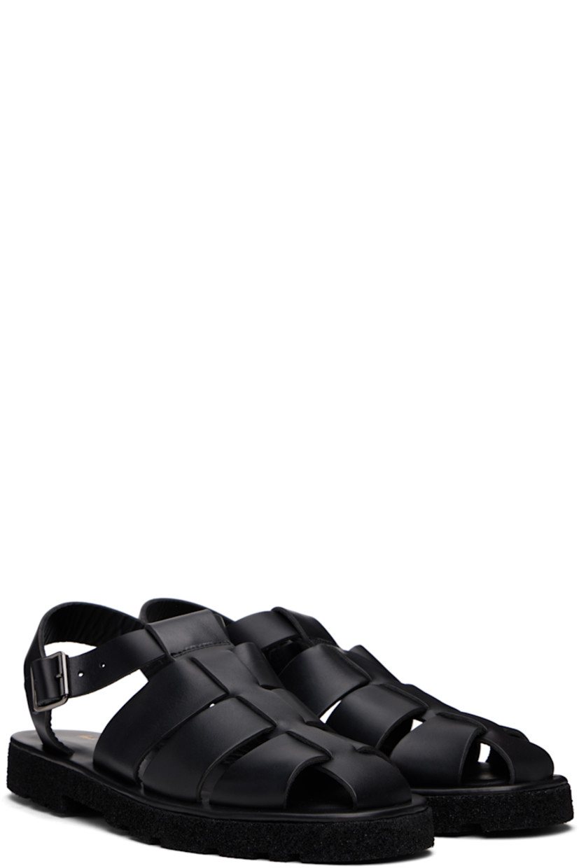 Woven buffed leather sandals in black.

· Pin-buckle ankle strap
· Logo stamp at padded footbed
· Treaded Rubex® rubber sole

Supplier color: Black
