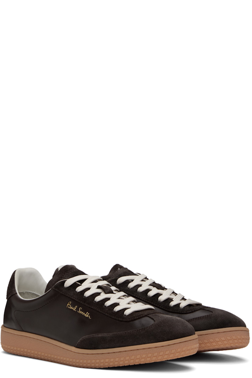 Low-top buffed calfskin and suede sneakers in brown.

· Lace-up closure
· Logo embossed at padded tongue
· Padded collar
· Logo hardware at outer side
· Signature stripe grosgrain trim at heel tab
· Buffed leather and suede lining
· Treaded Vibram® rubber sole

Supplier color: Brown