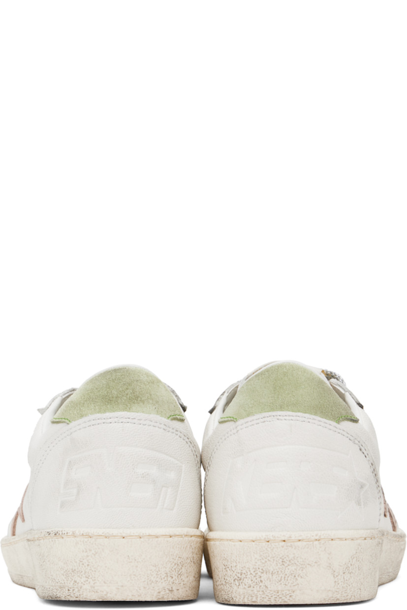 Handcrafted low-top grained leather sneakers in white.

· Smudging and perforated detailing throughout
· Lace-up closure
· Logo patch at padded tongue
· Padded collar
· Star appliqué and logo stamp at outer side
· Text embossed at heel counter
· Terrycloth, suede, and buffed leather lining
· Treaded rubber sole

Supplier color: White/Moonlight pink