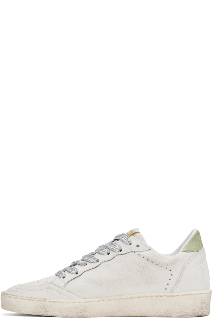 Handcrafted low-top grained leather sneakers in white.

· Smudging and perforated detailing throughout
· Lace-up closure
· Logo patch at padded tongue
· Padded collar
· Star appliqué and logo stamp at outer side
· Text embossed at heel counter
· Terrycloth, suede, and buffed leather lining
· Treaded rubber sole

Supplier color: White/Moonlight pink