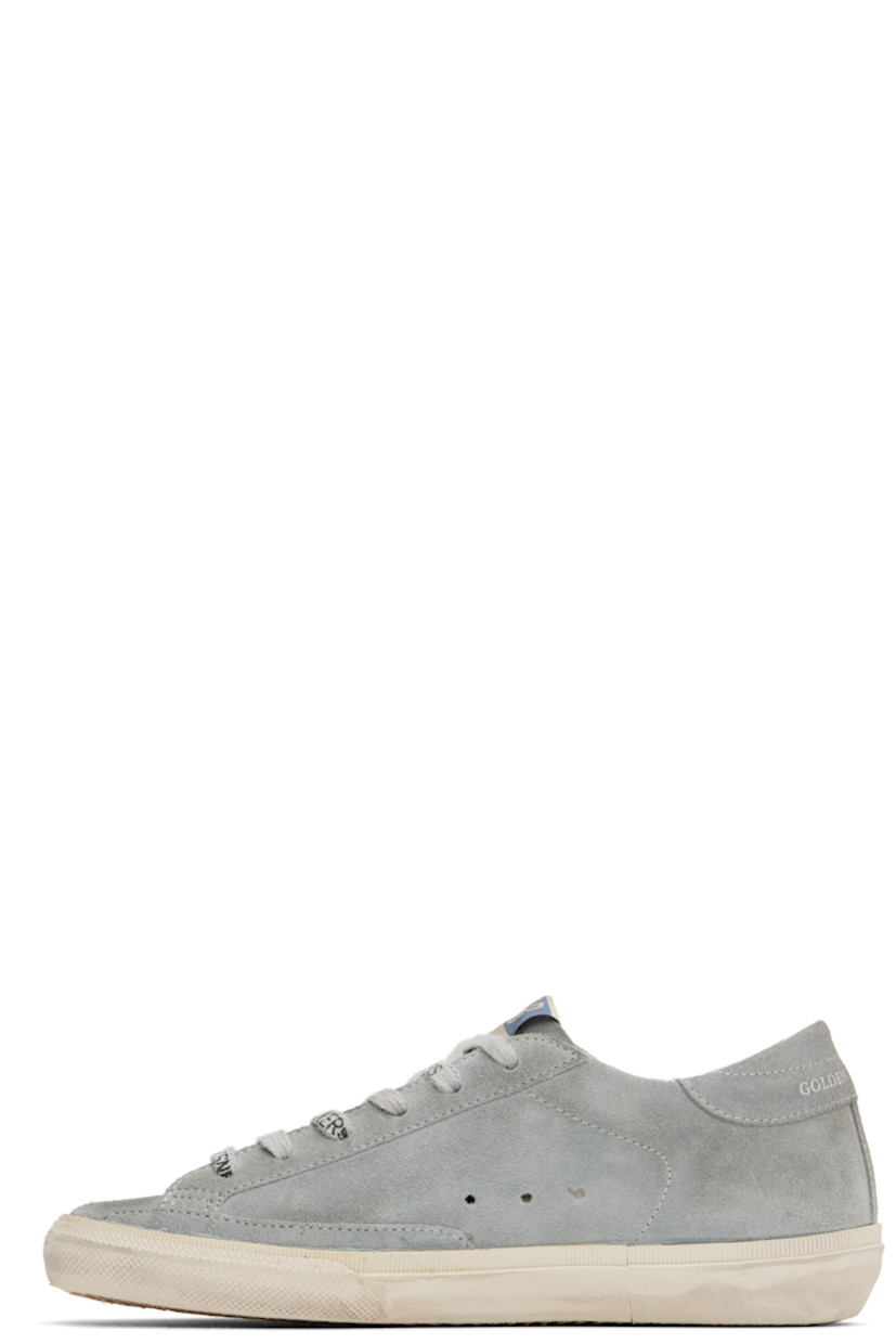 Handcrafted low-top suede sneakers in gray and pink.

· Smudging and subtle distressing throughout
· Logo-printed lace-up closure
· Logo flag at padded tongue
· Padded collar
· Perforations at sides
· Buffed leather star appliqué at outer side
· Logo stamp at outer side
· Logo printed at heel tab
· Suede, buffed faux-leather, and terrycloth lining
· Treaded rubber sole

Supplier color: Quarry/Shadow grey