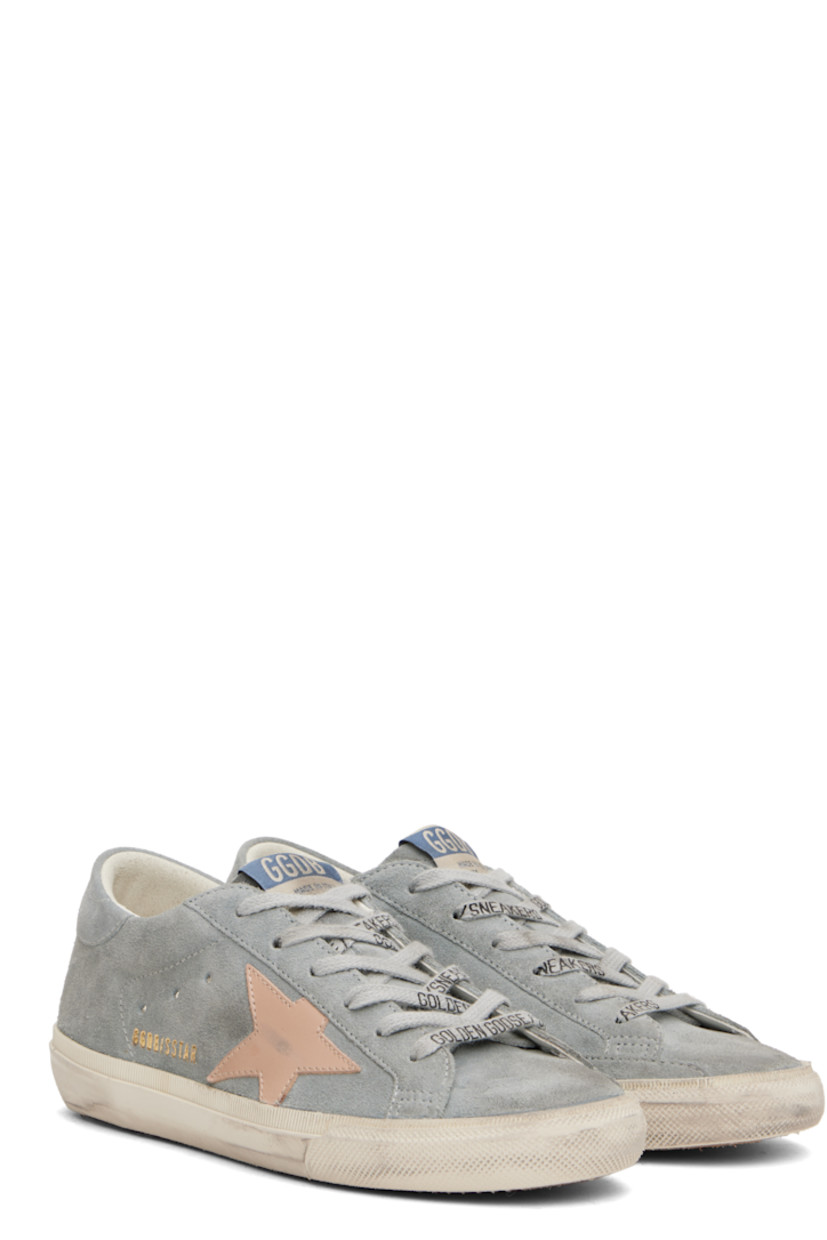 Handcrafted low-top suede sneakers in gray and pink.

· Smudging and subtle distressing throughout
· Logo-printed lace-up closure
· Logo flag at padded tongue
· Padded collar
· Perforations at sides
· Buffed leather star appliqué at outer side
· Logo stamp at outer side
· Logo printed at heel tab
· Suede, buffed faux-leather, and terrycloth lining
· Treaded rubber sole

Supplier color: Quarry/Shadow grey