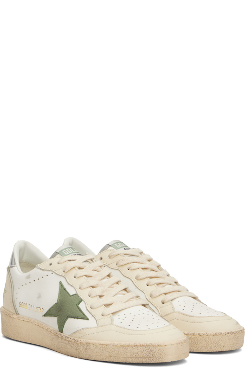 Handcrafted low-top buffed leather sneakers in off-white and khaki.

· Smudging and perforations throughout
· Lace-up closure
· Logo flag at tongue
· Padded collar
· Grained leather star appliqué at outer side
· Logo stamp at outer side
· Text embossed at heel counter
· Grained leather, suede, and terrycloth lining
· Treaded rubber sole

Supplier color: White/Green/Silver