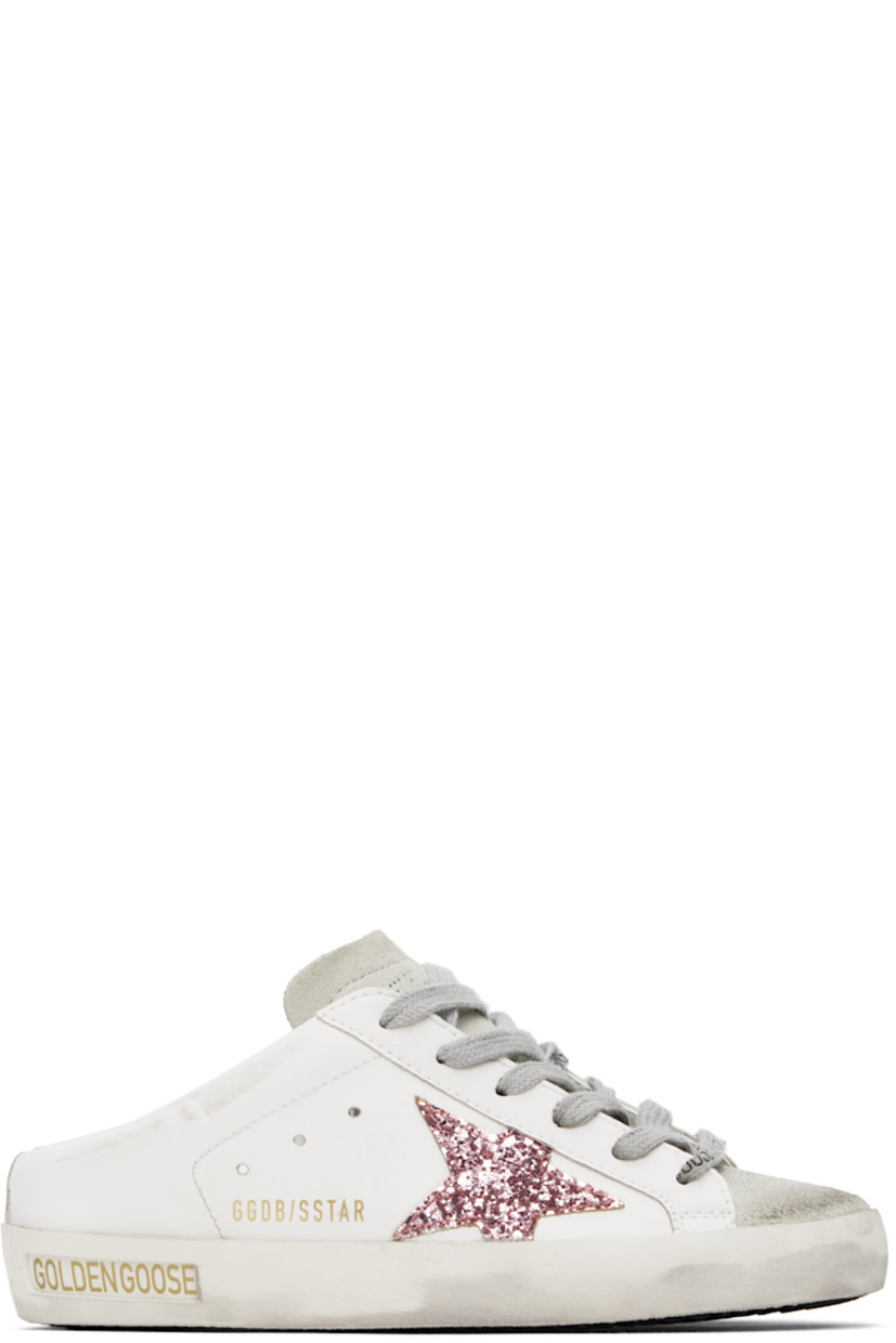 Low-top buffed faux-leather slip-on sneakers in white.

· Smudging and distressing throughout
· Lace-up closure
· Suede toe and tongue
· Logo perforated at tongue
· Perforations at sides
· Glittered star appliqué at outer side
· Logo stamp at outer side
· Logo stamp at padded footbed
· Buffed faux-leather and terrycloth lining
· Inset logo patch at rubber midsole
· Treaded rubber sole

Supplier color: White/Pink/Ice-gray