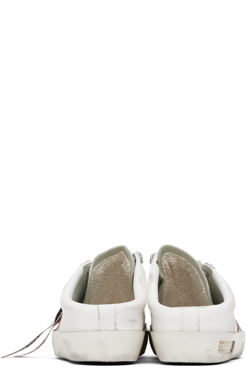 Low-top buffed faux-leather slip-on sneakers in white.

· Smudging and distressing throughout
· Lace-up closure
· Suede toe and tongue
· Logo perforated at tongue
· Perforations at sides
· Glittered star appliqué at outer side
· Logo stamp at outer side
· Logo stamp at padded footbed
· Buffed faux-leather and terrycloth lining
· Inset logo patch at rubber midsole
· Treaded rubber sole

Supplier color: White/Pink/Ice-gray