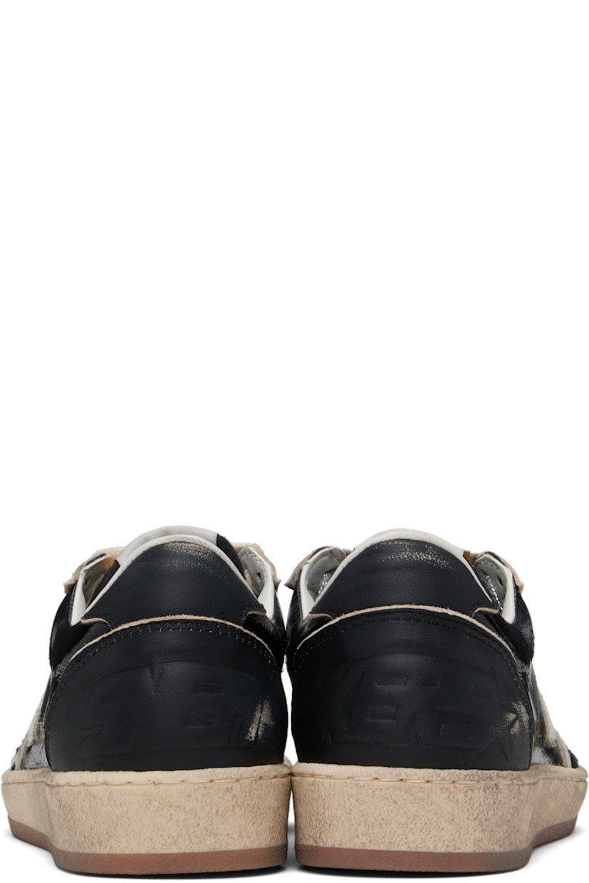 Handcrafted low-top paneled suede and buffed leather sneakers in black.

· Smudging, distressing, and perforated detailing throughout
· Lace-up closure
· Logo patch at padded tongue
· Padded collar
· Signature star appliqué at outer side
· Logo stamp at outer side
· Logo embossed at heel
· Suede, buffed leather, and terrycloth lining
· Treaded rubber sole

Supplier color: Black/Off-White