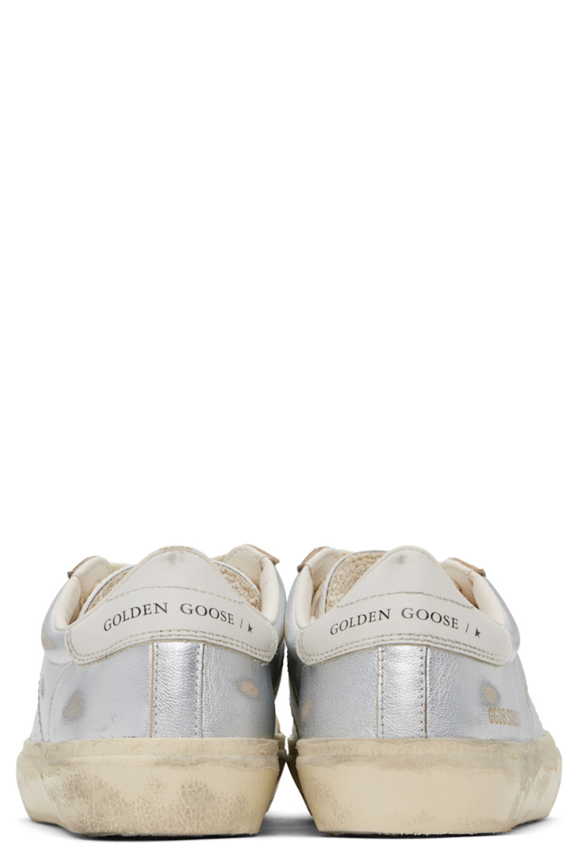 Handcrafted low-top grained sheepskin sneakers in metallic silver tone. 

· Smudging and subtle distressing throughout
· Lace-up closure
· Logo embossed at padded tongue
· Padded collar
· Logo flag and stamp at outer side
· Logo printed at buffed leather heel tab
· Buffed faux-leather and terrycloth lining
· Treaded rubber sole

Supplier color: Silver/White/Milk white