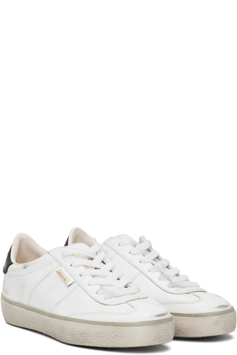 Low-top buffed leather sneakers in white.

· Distressing and smudging throughout
· Lace-up closure
· Logo embossed at padded tongue
· Padded collar
· Logo stamp at outer side
· Logo embossed at heel tab
· Buffed leather and terrycloth lining
· Textured rubber midsole
· Treaded rubber sole

Supplier color: White/Black