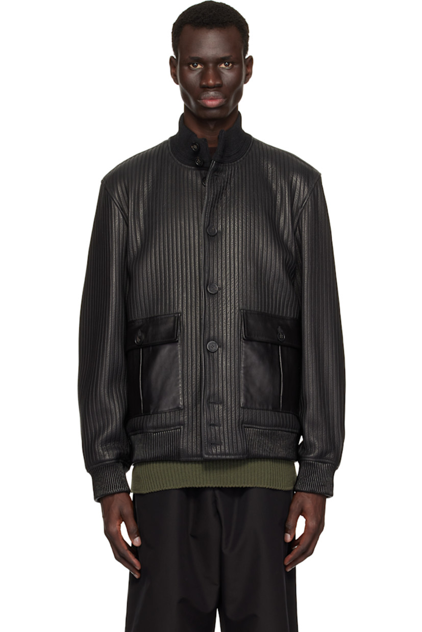 Grained sheepskin leather bomber jacket. Stripes embossed throughout.

· Rib-knit stand collar
· Button closure
· Flap pockets
· Elasticized hem and cuffs 
· Logo hardware at back collar
· Welt pockets at interior
· Full twill lining

Supplier color: Black