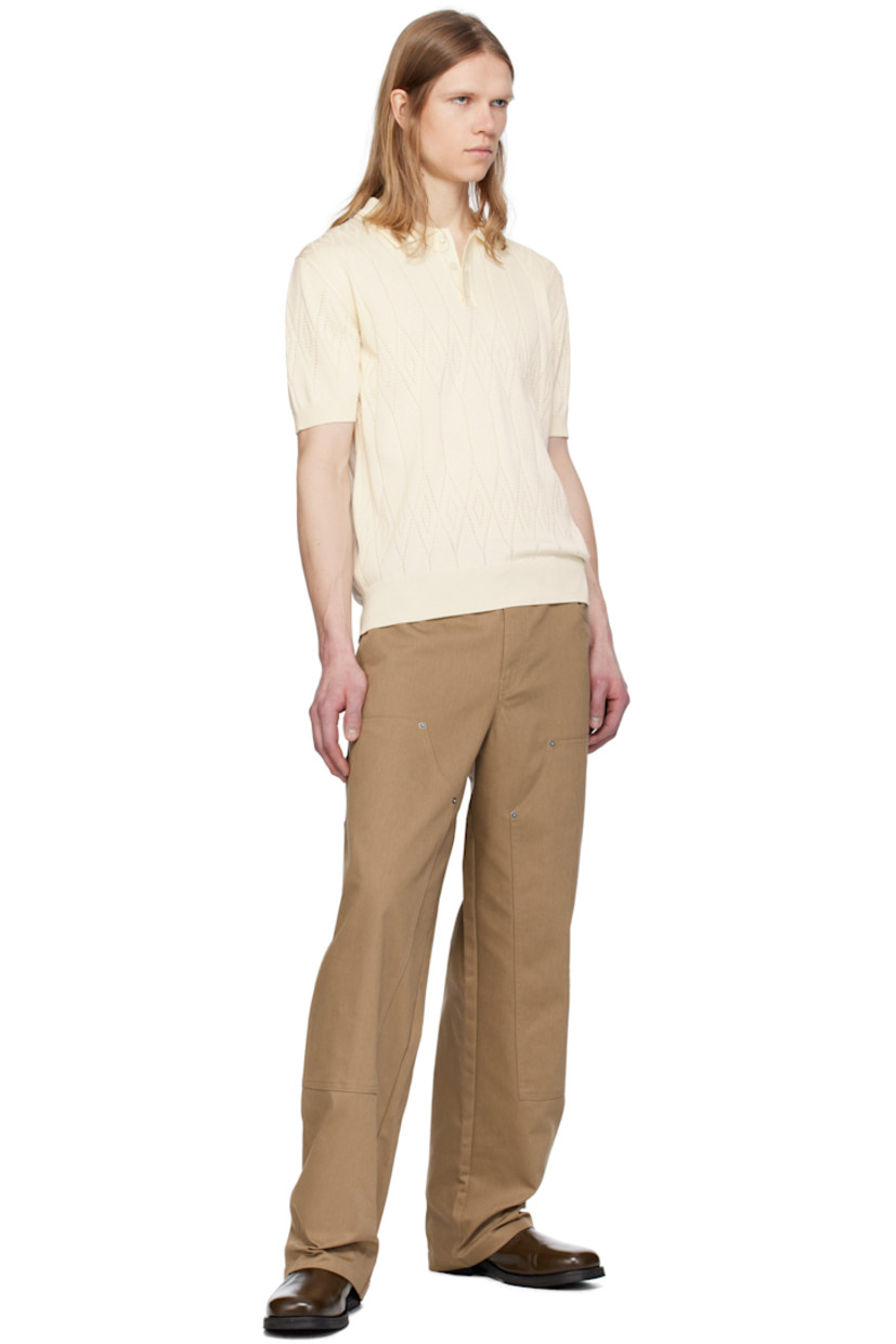 Pointelle-knit cotton- and viscose-blend polo. Argyle pattern throughout. 

· Rib-knit spread collar, placket, hem, and cuffs 
· Three-button placket 
· Logo hardware at back collar 

Part of the Journey collection.

Supplier color: Heritage white