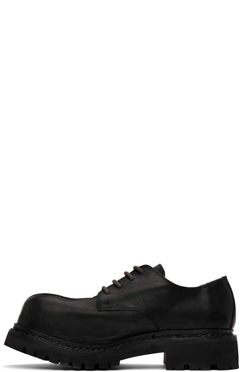 Handcrafted grained horse leather derbys in black.

· Encased metal toe
· Lace-up closure
· Buffed leather and suede lining
· Textured rubber midsole and heel
· Margom® lugged rubber sole
· Heel: H1.75"

Supplier color: Black