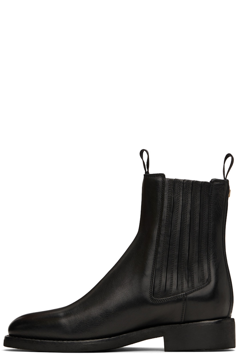 Handcrafted ankle-high grained leather Chelsea boots in black.

· Pull-loops at collar
· Elasticized gusset at sides
· Logo stamp at outer side
· Logo hardware at heel collar
· Buffed leather lining
· Topstitching at welt
· Rubber block heel
· Treaded rubber sole

Supplier color: Black