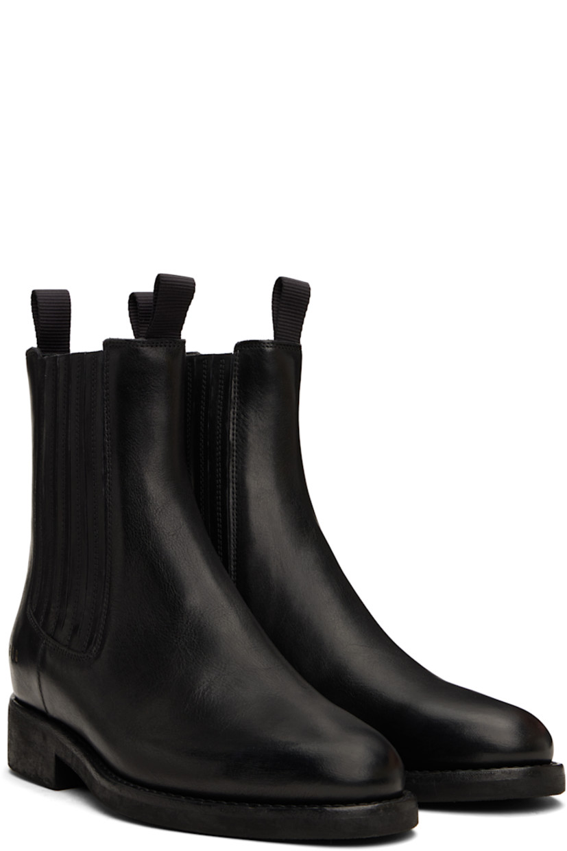 Handcrafted ankle-high grained leather Chelsea boots in black.

· Pull-loops at collar
· Elasticized gusset at sides
· Logo stamp at outer side
· Logo hardware at heel collar
· Buffed leather lining
· Topstitching at welt
· Rubber block heel
· Treaded rubber sole

Supplier color: Black