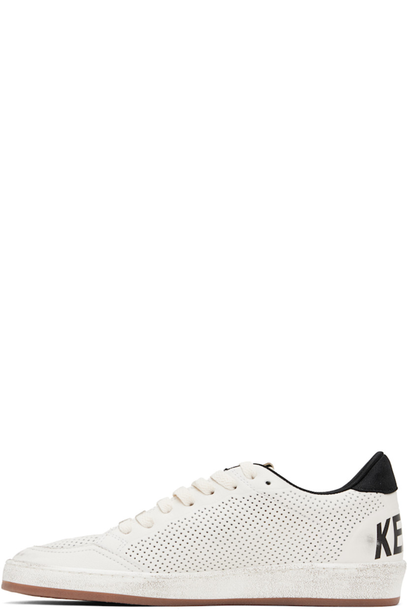 Handcrafted low-top grained faux-leather sneakers in white. 

· Smudging and perforations throughout 
· Lace-up closure
· Logo flag at padded tongue
· Padded collar 
· Star appliqué at outer side
· Jersey heel tab 
· Text printed at heel counter 
· Terrycloth lining  
· Treaded rubber sole 

Supplier color: White/Black