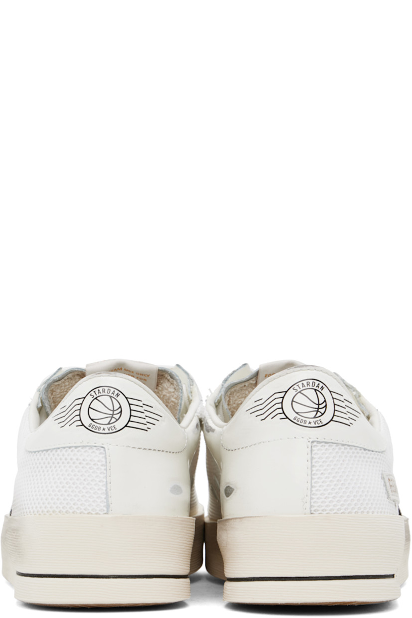 Handcrafted low-top buffed leather and mesh sneakers in white.

· Smudging throughout
· Lace-up closure
· Logo patch at padded tongue
· Padded collar
· Star appliqué and logo stamp at outer side
· Metal eyelets at inner side
· Logo graphic printed at heel tab
· Terrycloth, suede, and buffed leather lining
· Treaded rubber sole

Supplier color: White/Black