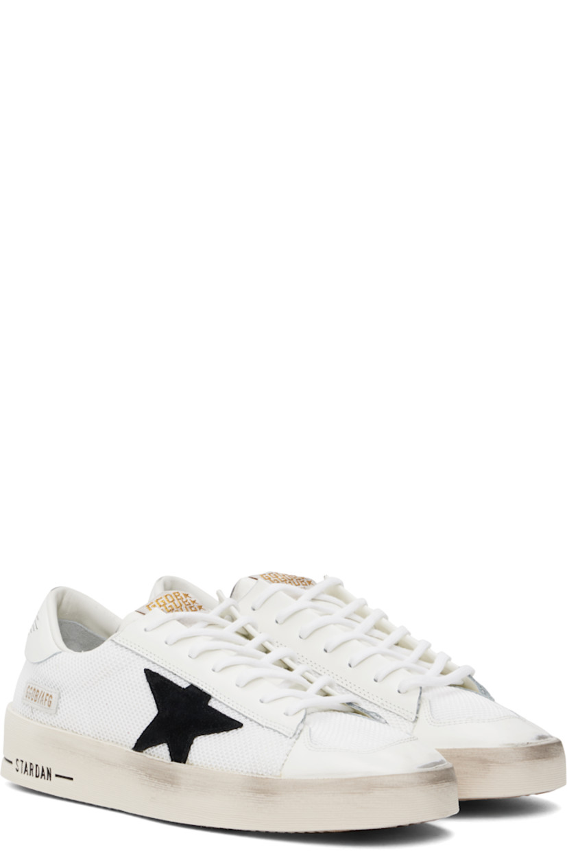 Handcrafted low-top buffed leather and mesh sneakers in white.

· Smudging throughout
· Lace-up closure
· Logo patch at padded tongue
· Padded collar
· Star appliqué and logo stamp at outer side
· Metal eyelets at inner side
· Logo graphic printed at heel tab
· Terrycloth, suede, and buffed leather lining
· Treaded rubber sole

Supplier color: White/Black