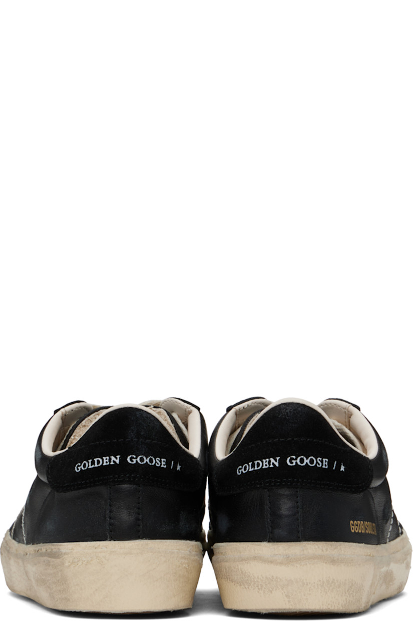 Low-top handcrafted buffed sheepskin sneakers in black.

· Smudging throughout
· Lace-up closure
· Logo patch at padded tongue
· Padded collar
· Logo flag and stamp at outer side
· Contrast stitching at sides
· Logo printed at suede heel tab
· Buffed leather and terrycloth lining
· Treaded rubber sole

Supplier color: Black
