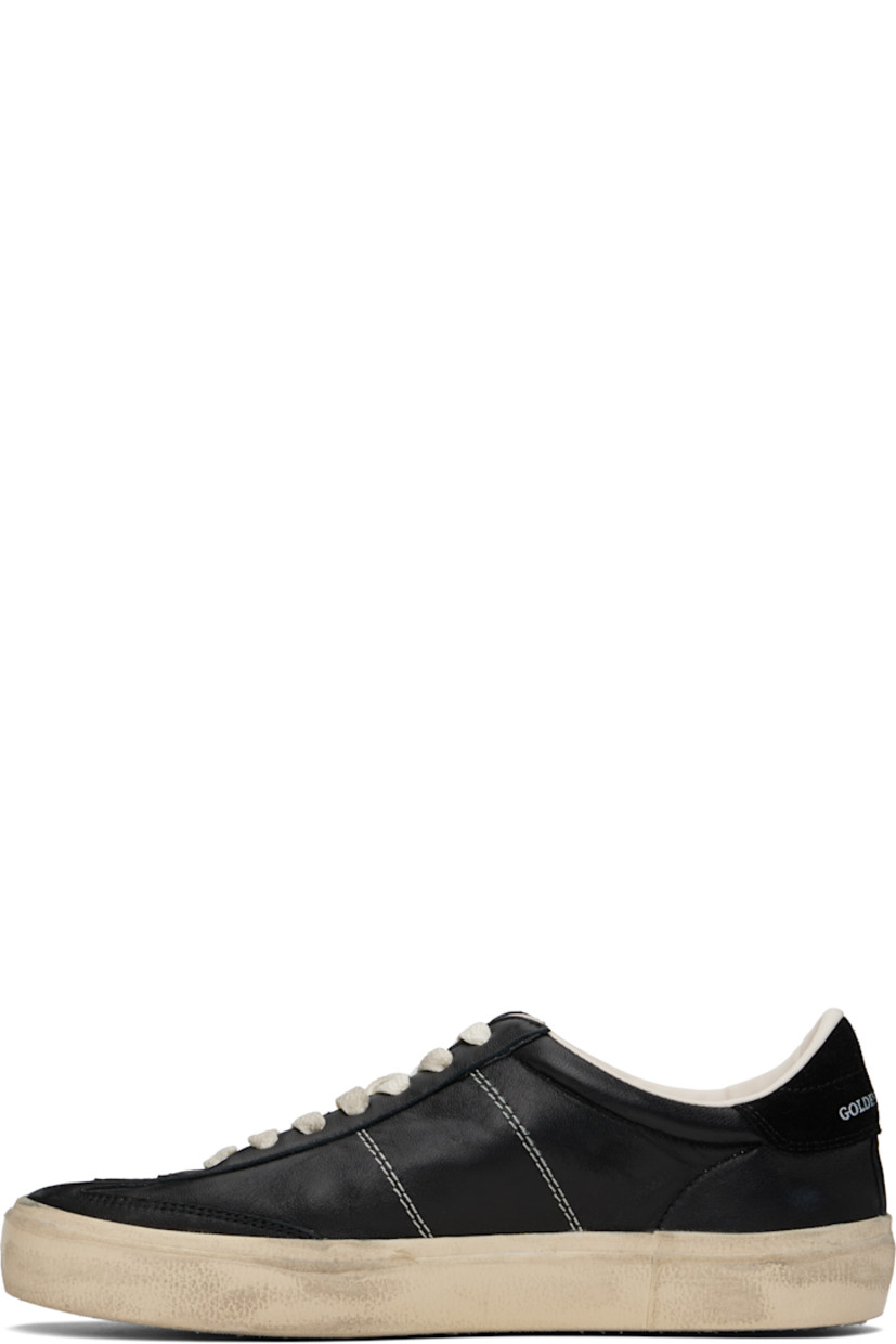 Low-top handcrafted buffed sheepskin sneakers in black.

· Smudging throughout
· Lace-up closure
· Logo patch at padded tongue
· Padded collar
· Logo flag and stamp at outer side
· Contrast stitching at sides
· Logo printed at suede heel tab
· Buffed leather and terrycloth lining
· Treaded rubber sole

Supplier color: Black