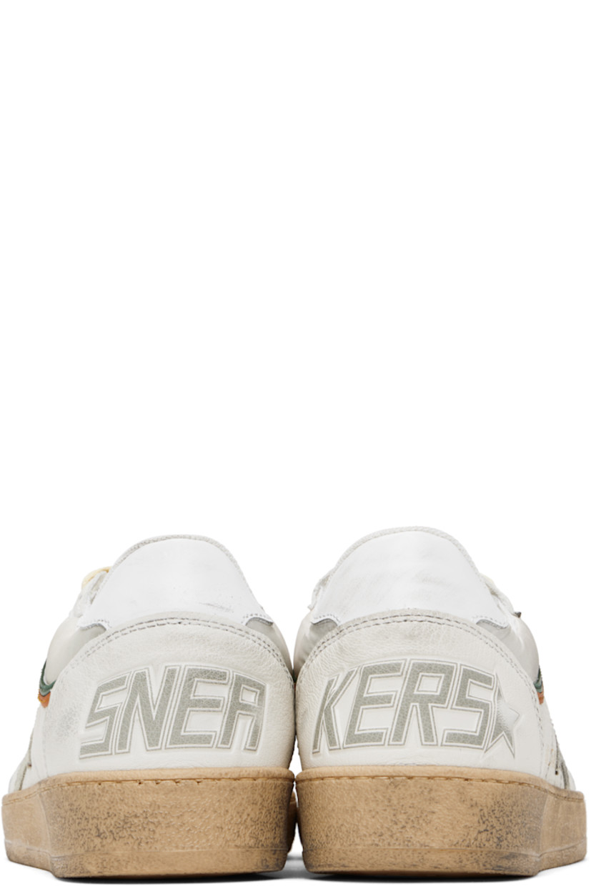 Handcrafted low-top nappa lambskin and buffed leather sneakers in white and beige.

· Smudging and subtle distressing throughout
· Perforations at toe
· Lace-up closure
· Text and logo printed at tongue
· Padded collar
· Star appliqué and logo stamp at outer side
· Text embossed at heel counter
· Suede, mesh, and terrycloth lining
· Treaded rubber sole

Supplier color: White/Beige/Ice/Green/Orange