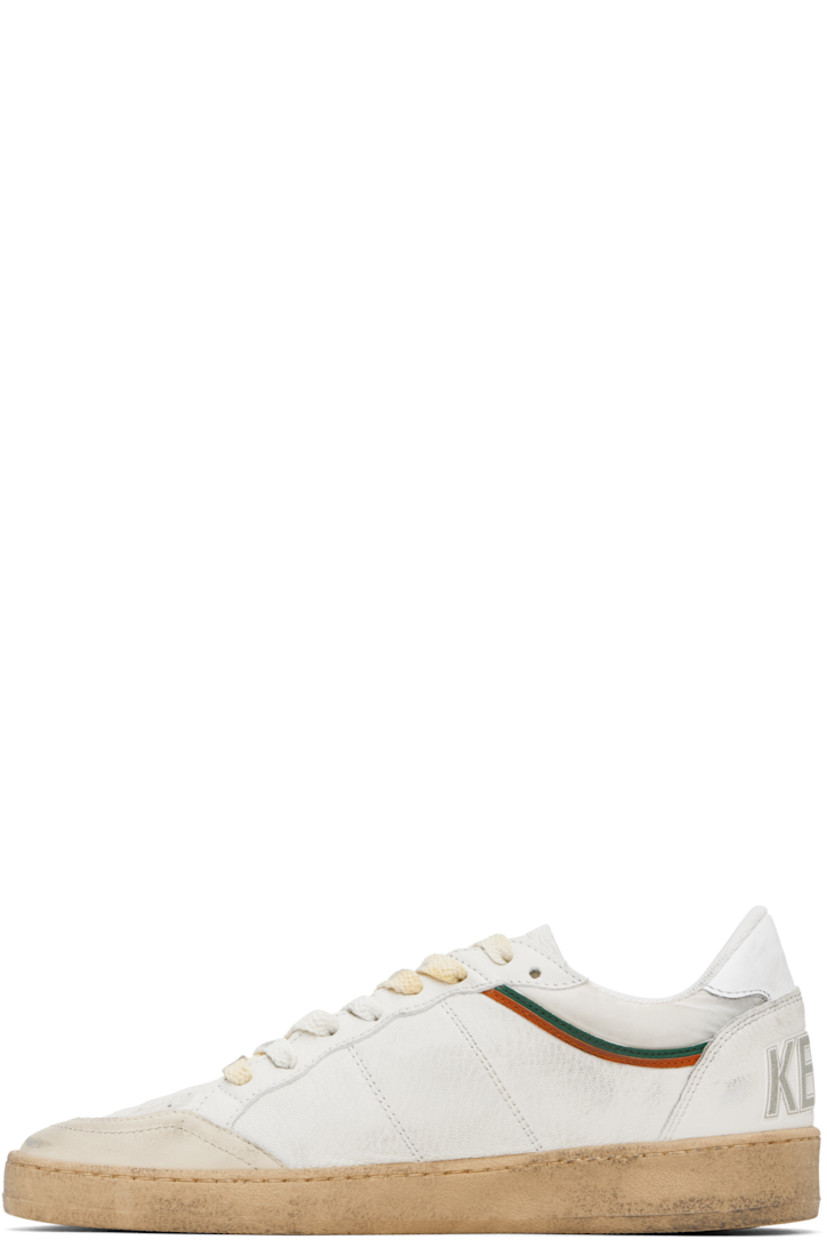 Handcrafted low-top nappa lambskin and buffed leather sneakers in white and beige.

· Smudging and subtle distressing throughout
· Perforations at toe
· Lace-up closure
· Text and logo printed at tongue
· Padded collar
· Star appliqué and logo stamp at outer side
· Text embossed at heel counter
· Suede, mesh, and terrycloth lining
· Treaded rubber sole

Supplier color: White/Beige/Ice/Green/Orange