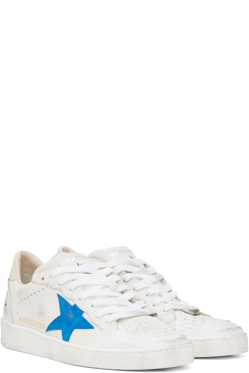 Handcrafted low-top grained leather sneakers in white. 

· Smudging and subtle distressing throughout 
· Crackled trim and perforations at toe
· Lace-up closure
· Logo stamp at padded mesh tongue 
· Star appliqué and logo stamp at outer side
· Perforations at sides
· Stripes embossed at heel tab 
· Logo printed at heel counter 
· Buffed leather, suede, and terrycloth lining 
· Treaded rubber sole 

Supplier color: White/Bluette/Wood