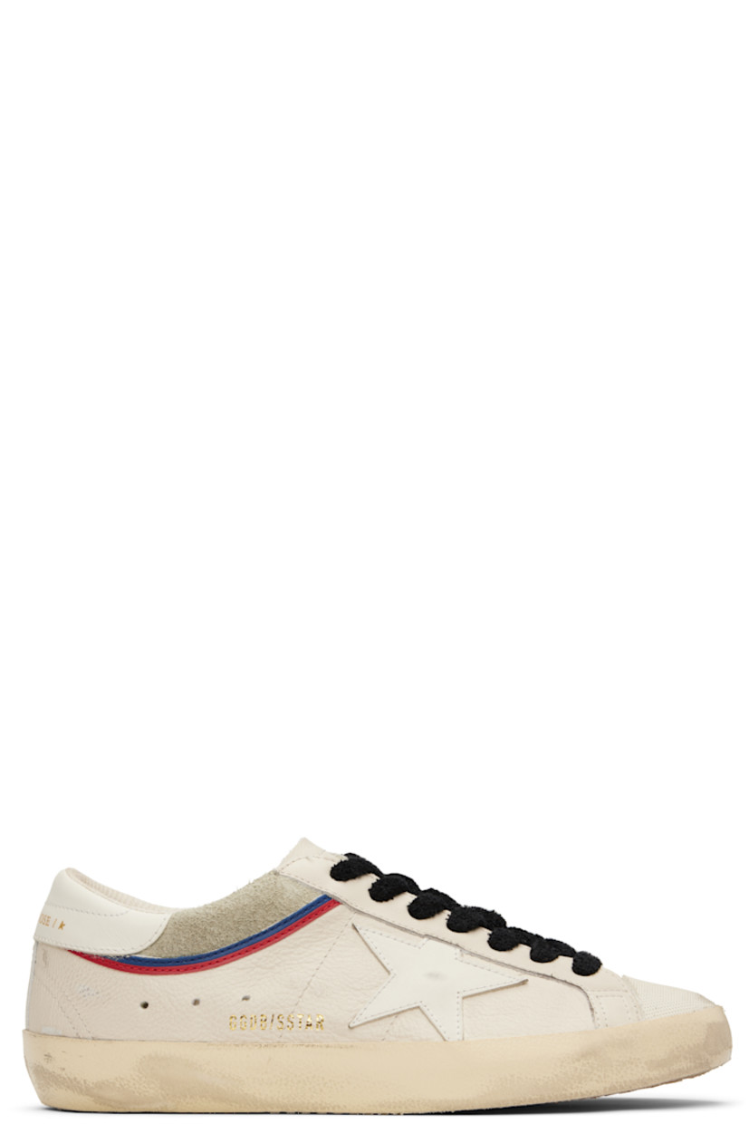 Low-top grained leather and suede sneakers in off-white.

· Smudging and distressing throughout
· Textured rubber cap toe
· Lace-up closure
· Perforated logo at tongue
· Padded collar
· Logo appliqué at sides
· Perforations at sides
· Gold-tone logo stamp at heel tab
· Mesh and terrycloth lining
· Treaded rubber sole

Supplier color: White/Grey