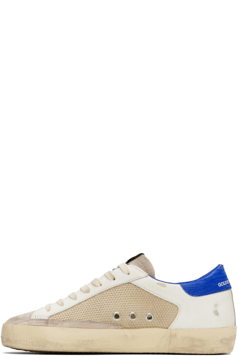 Handcrafted low-top buffed leather, suede, and mesh sneakers in beige and off-white.

· Smudging and subtle distressing throughout
· Lace-up closure
· Logo flag at tongue
· Padded collar
· Eyelets at sides
· Signature star appliqué at outer side
· Logo patch and printed logo at outer side 
· Logo printed at croc-embossed leather heel tab 
· Jersey and terrycloth lining
· Treaded rubber sole

Supplier color: Latte/White/Bluette