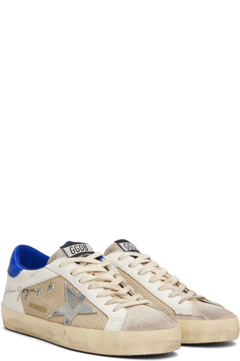 Handcrafted low-top buffed leather, suede, and mesh sneakers in beige and off-white.

· Smudging and subtle distressing throughout
· Lace-up closure
· Logo flag at tongue
· Padded collar
· Eyelets at sides
· Signature star appliqué at outer side
· Logo patch and printed logo at outer side 
· Logo printed at croc-embossed leather heel tab 
· Jersey and terrycloth lining
· Treaded rubber sole

Supplier color: Latte/White/Bluette
