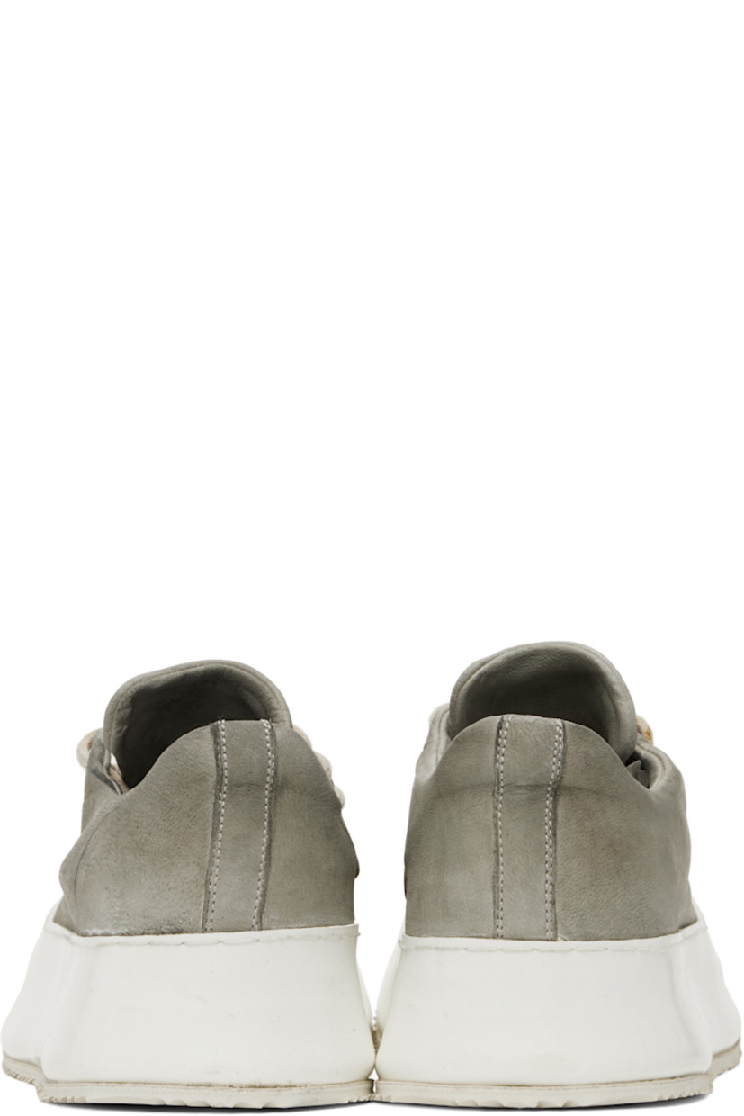 Handcrafted low-top grained goatskin sneakers in gray.

· Smudging and distressing throughout
· Lace-up closure
· Padded collar
· Eyelets at inner side
· Extended rubber welt
· Treaded rubber sole
· Contrast stitching in white

Supplier color: Grey
