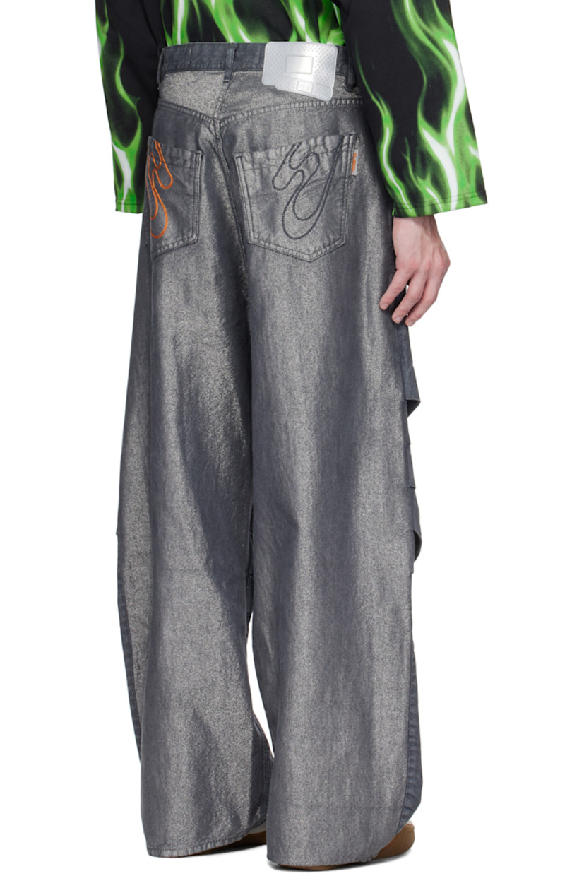 Non-stretch denim jeans. Metallic threads throughout. 

· Belt loops
· Five-pocket styling
· Zip fly
· Tucks at knees 
· Logo patch at back waistband
· Topstitching at back pockets

Supplier color: Grigio anthracite
