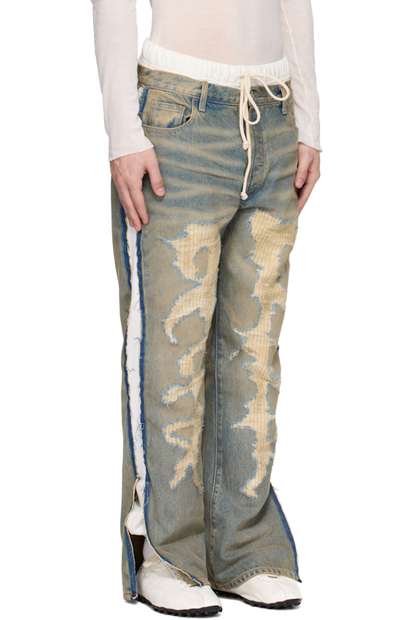 Non-stretch denim and cotton fleece jeans. Fading, whiskering, and distressing throughout. 

· Layered and paneled construction
· Drawstring elasticized waistband
· Belt loops
· Five-pocket styling
· Button fly
· Logo printed at front legs
· Elasticized cuffs
· Frayed edge at vented outseams
· Logo patch at back waistband

Supplier color: Light indigo